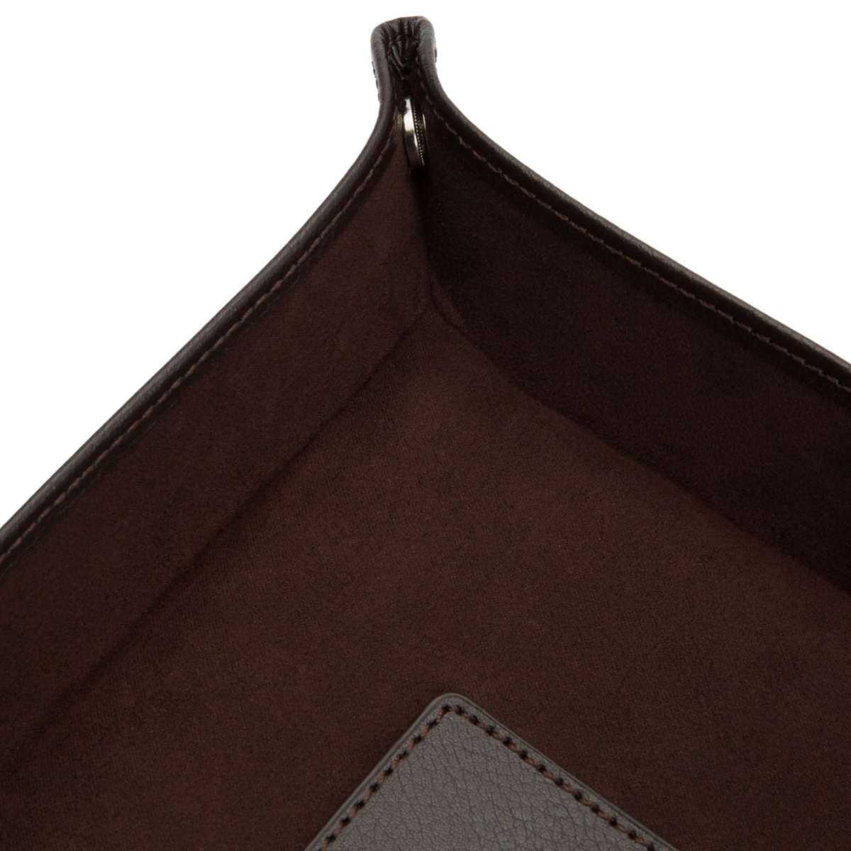 The tray is lined providing a gentle surface for watches, jewellery, and other valuables.
Snap-corner construction gives the piece its distinctive shape while allowing it to sit neatly wherever it's placed.
A subtle blend of luxury materials and functional design.