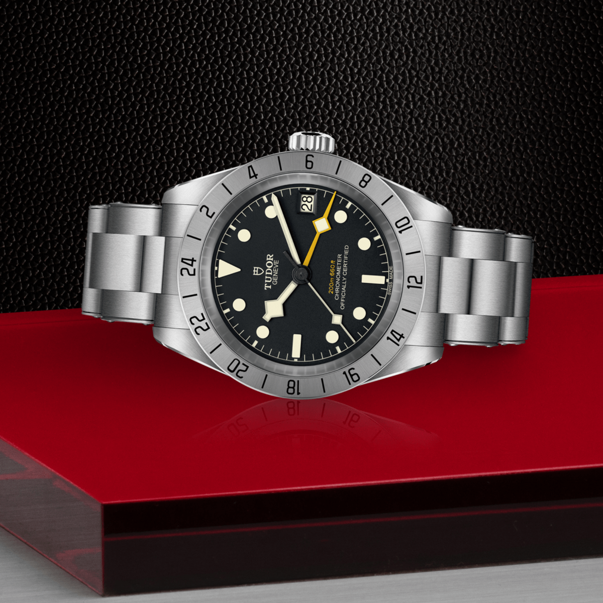 Tudor GMT watch positioned on its side highlighting the case thickness, fixed 24-hour bezel and screw-down crown