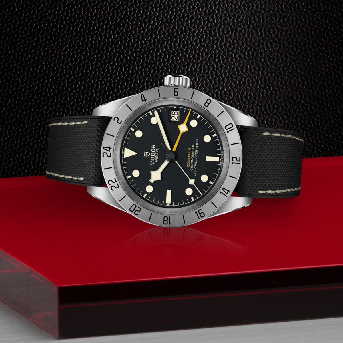 Tudor GMT watch positioned on its side highlighting the case thickness, fixed 24-hour bezel and screw-down crown