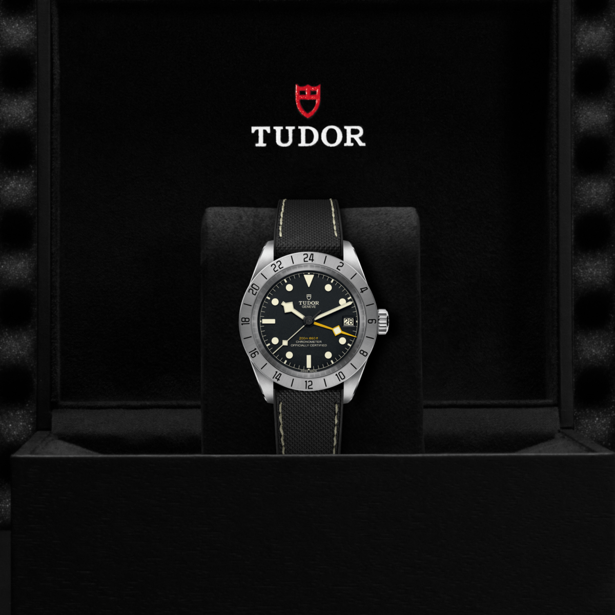 Tudor GMT watch displayed in its presentation box showcasing the premium packaging and interior finish