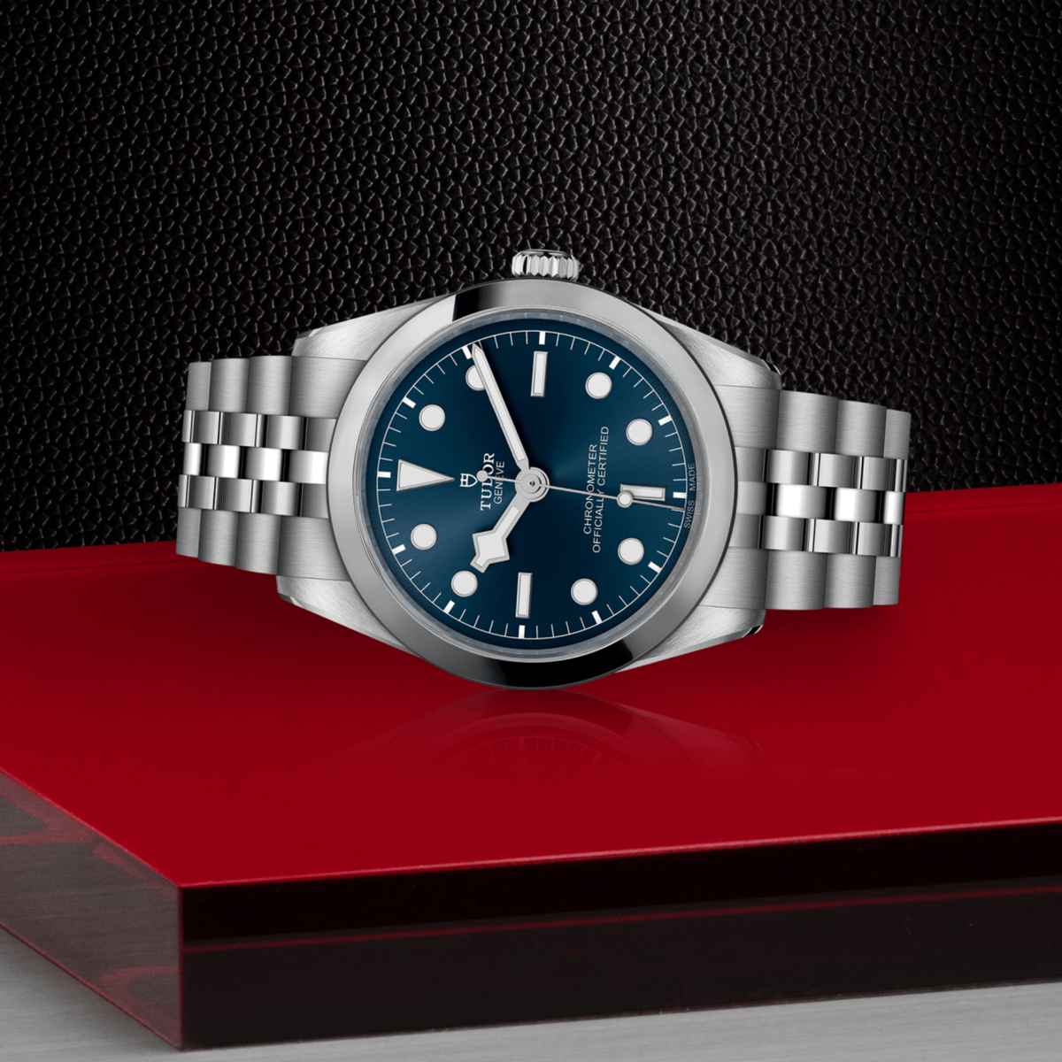 Tudor Black Bay One watch positioned on its side highlighting the polished case, smooth bezel and screw-down crown