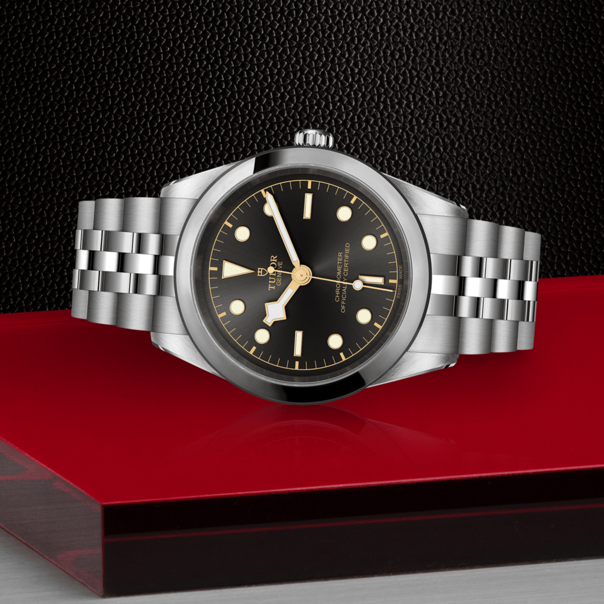 Tudor Black Bay One watch positioned on its side highlighting the polished case, smooth bezel and screw-down crown