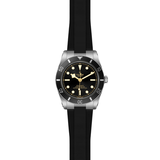 full view of Tudor watch showing the complete black rubber strap and robust case profile