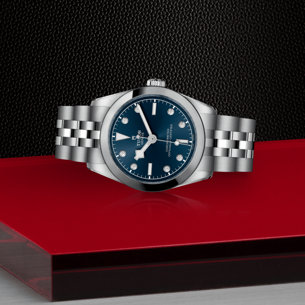 Tudor Black Bay One watch positioned on its side highlighting the slim case profile, smooth bezel and screw-down crown