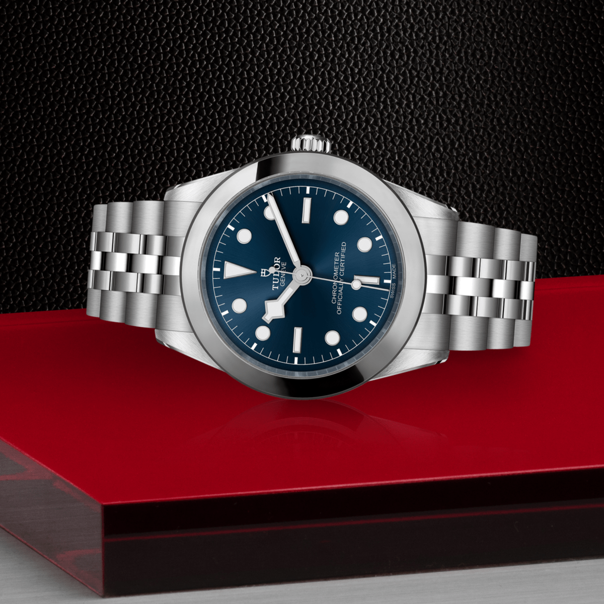 Tudor Black Bay One watch positioned on its side highlighting the polished case, smooth bezel and screw-down crown