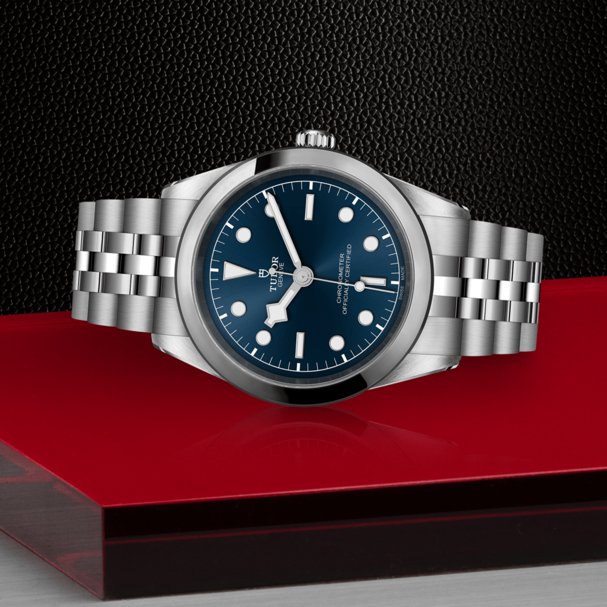 Tudor Black Bay One watch positioned on its side highlighting the polished case, smooth bezel and screw-down crown