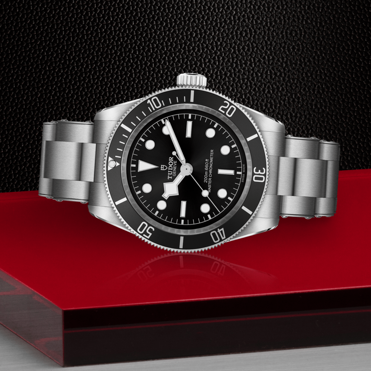 Tudor dive watch positioned on its side highlighting the case thickness, rotating bezel edge and screw-down crown