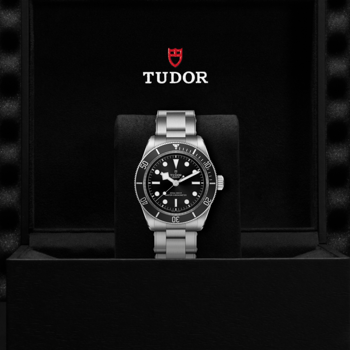 Tudor dive watch displayed in its presentation box showcasing the premium packaging and interior finish