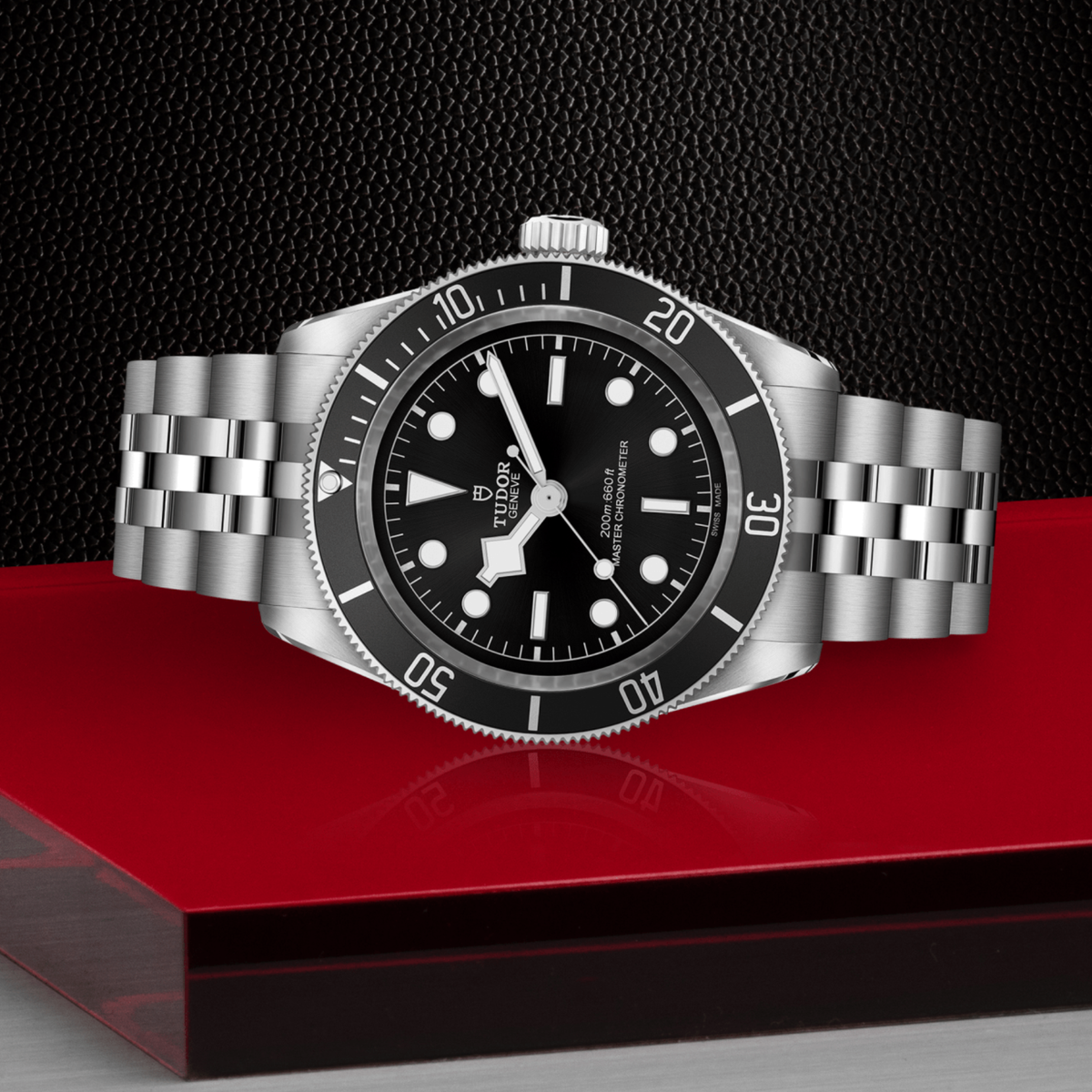 Tudor dive watch positioned on its side highlighting the case thickness, rotating bezel edge and screw-down crown