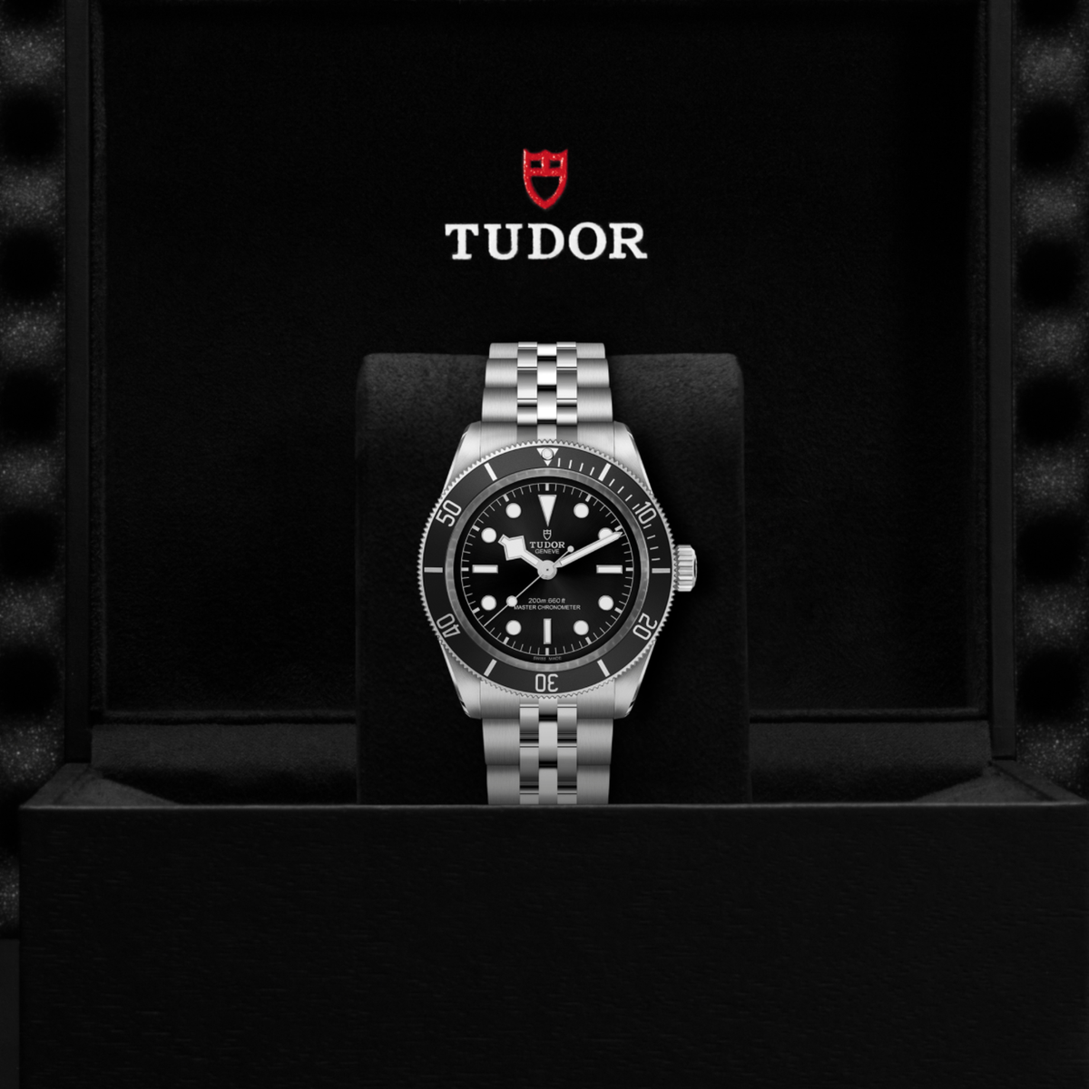 Tudor dive watch displayed in its presentation box showcasing the premium packaging and interior finish