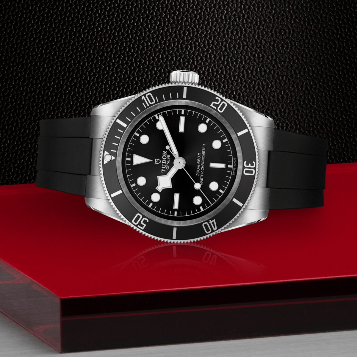 Tudor dive watch positioned on its side highlighting the case thickness, rotating bezel edge and screw-down crown