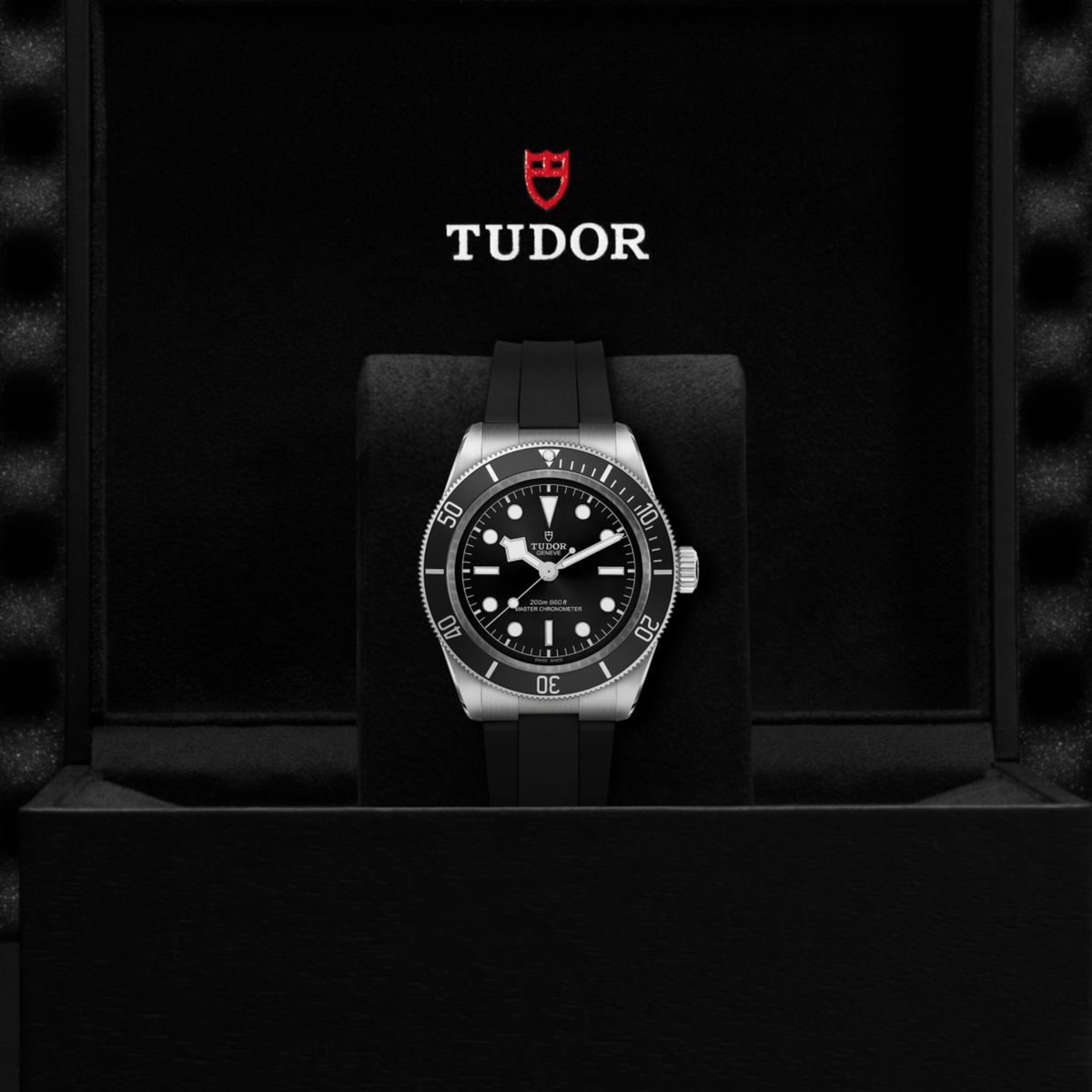 Tudor dive watch displayed in its presentation box showcasing the premium packaging and interior finish