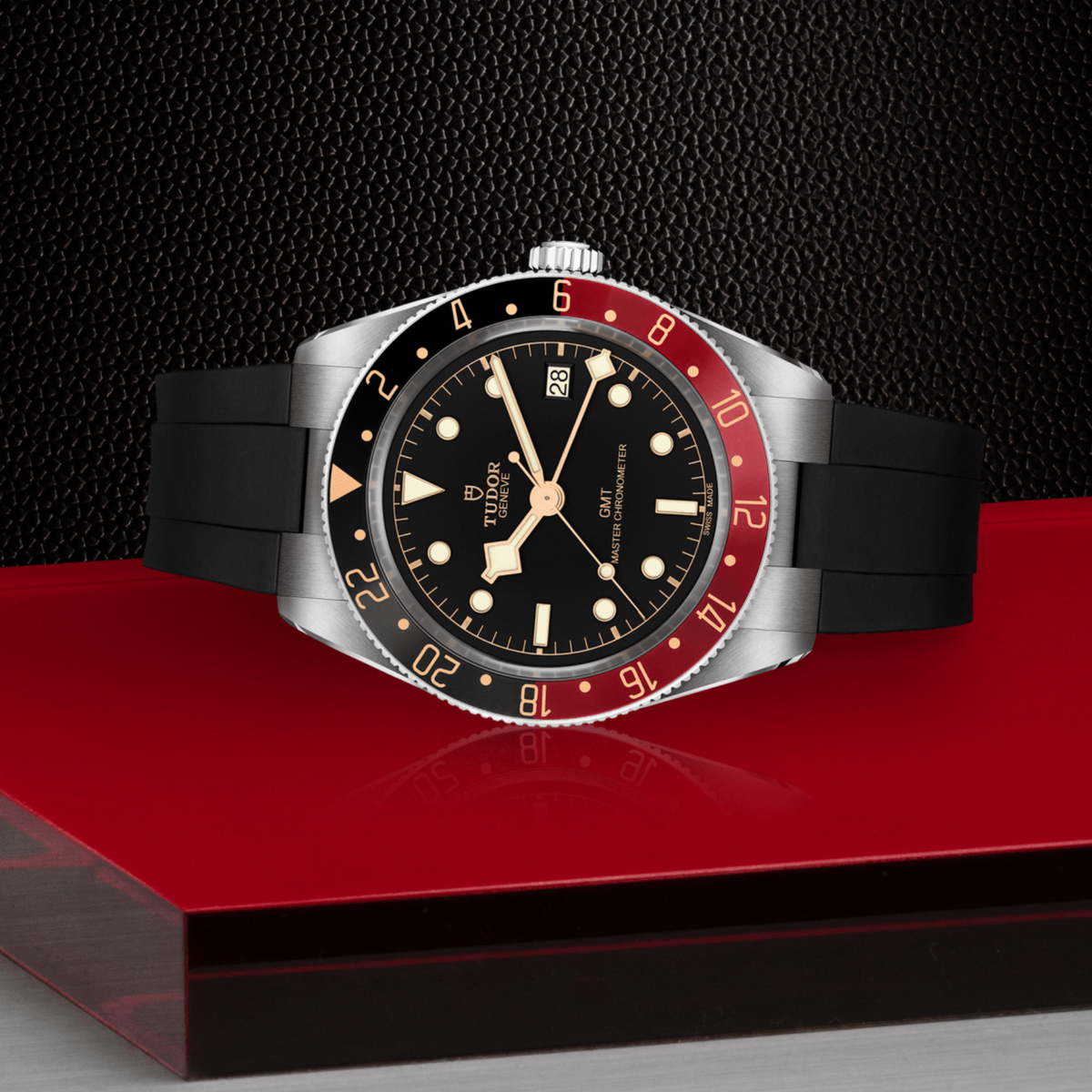 Tudor GMT watch positioned on its side highlighting the case thickness, bidirectional bezel edge and screw-down crown
