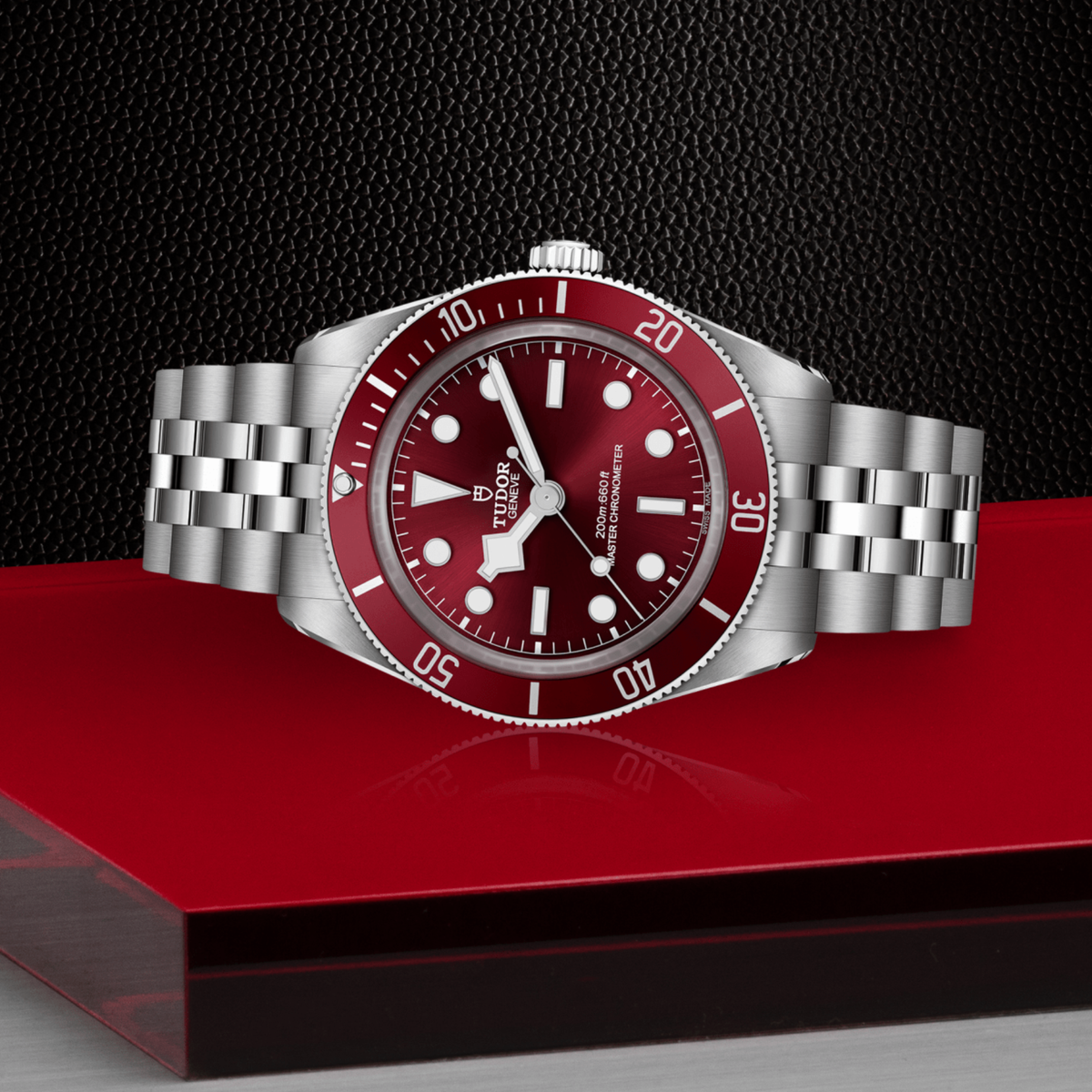 Tudor dive watch positioned on its side highlighting the case thickness, rotating bezel edge and crown detail