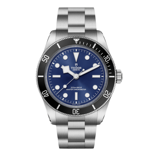 Tudor dive watch with blue dial, black bezel, luminous markers and stainless steel bracelet