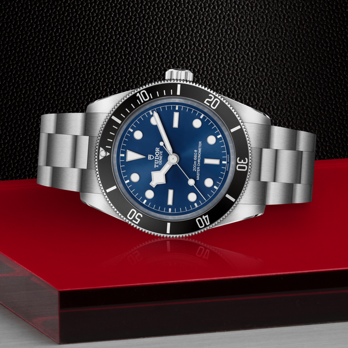 Tudor dive watch positioned on its side highlighting the case thickness, rotating bezel edge and screw-down crown