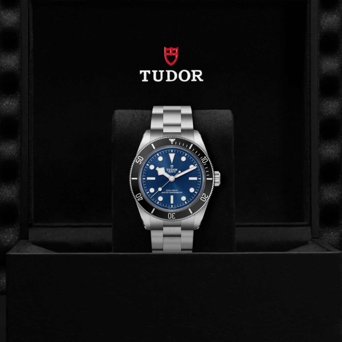 Tudor dive watch displayed in its presentation box showcasing the premium packaging and interior finish