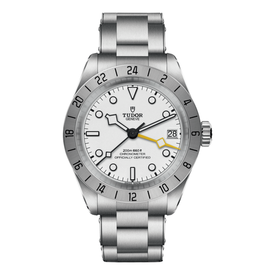 Tudor GMT watch with white dial, fixed 24-hour steel bezel, yellow GMT hand and stainless steel bracelet