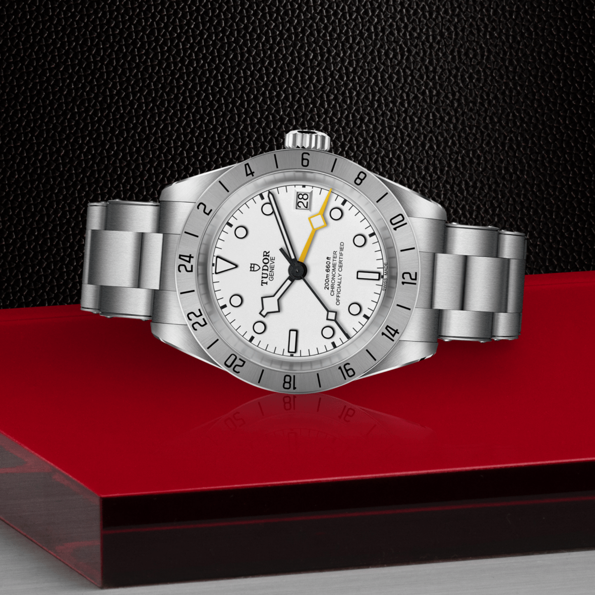 Tudor GMT watch positioned on its side highlighting the case thickness, fixed 24-hour bezel and screw-down crown