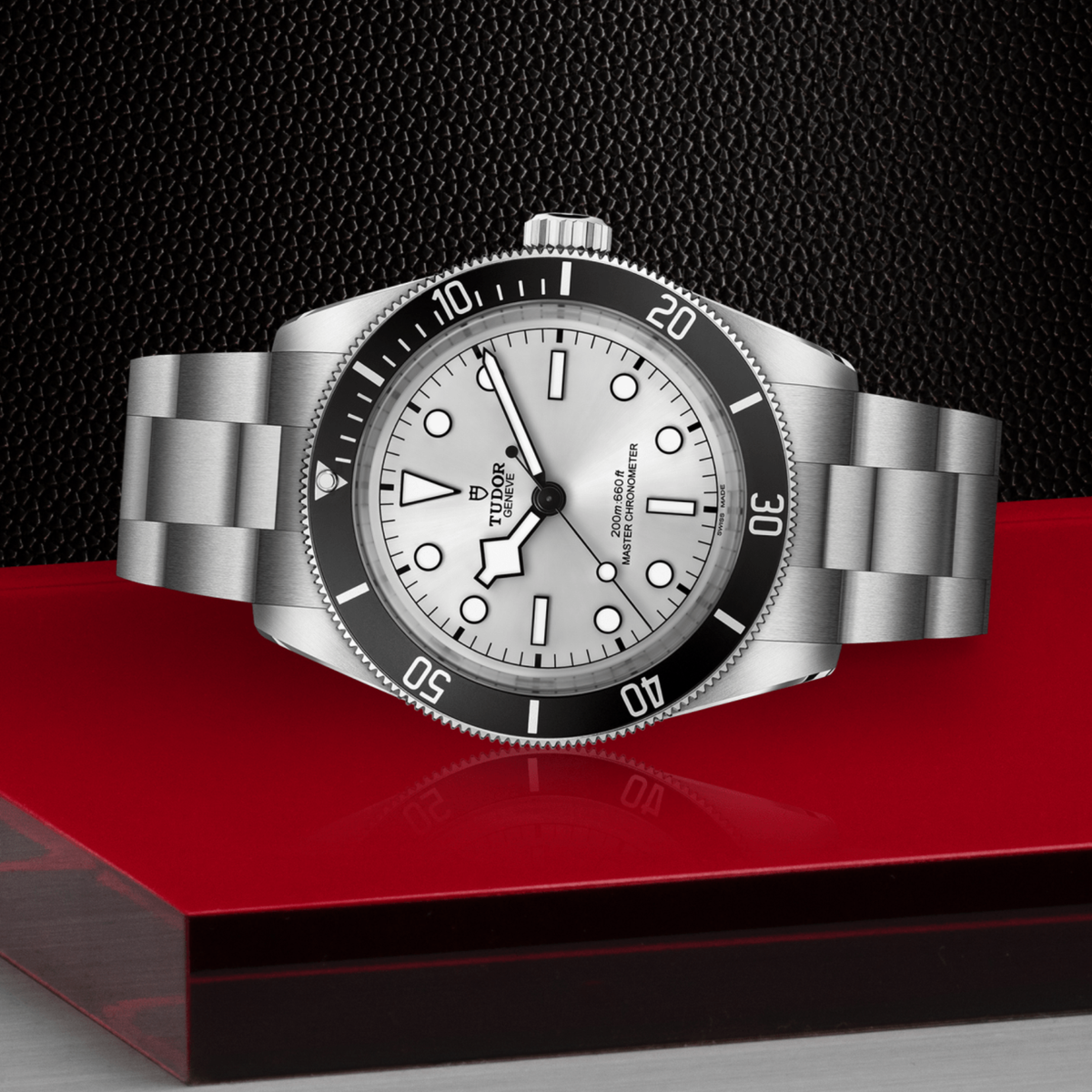 Tudor dive watch positioned on its side highlighting the case thickness, rotating bezel edge and screw-down crown