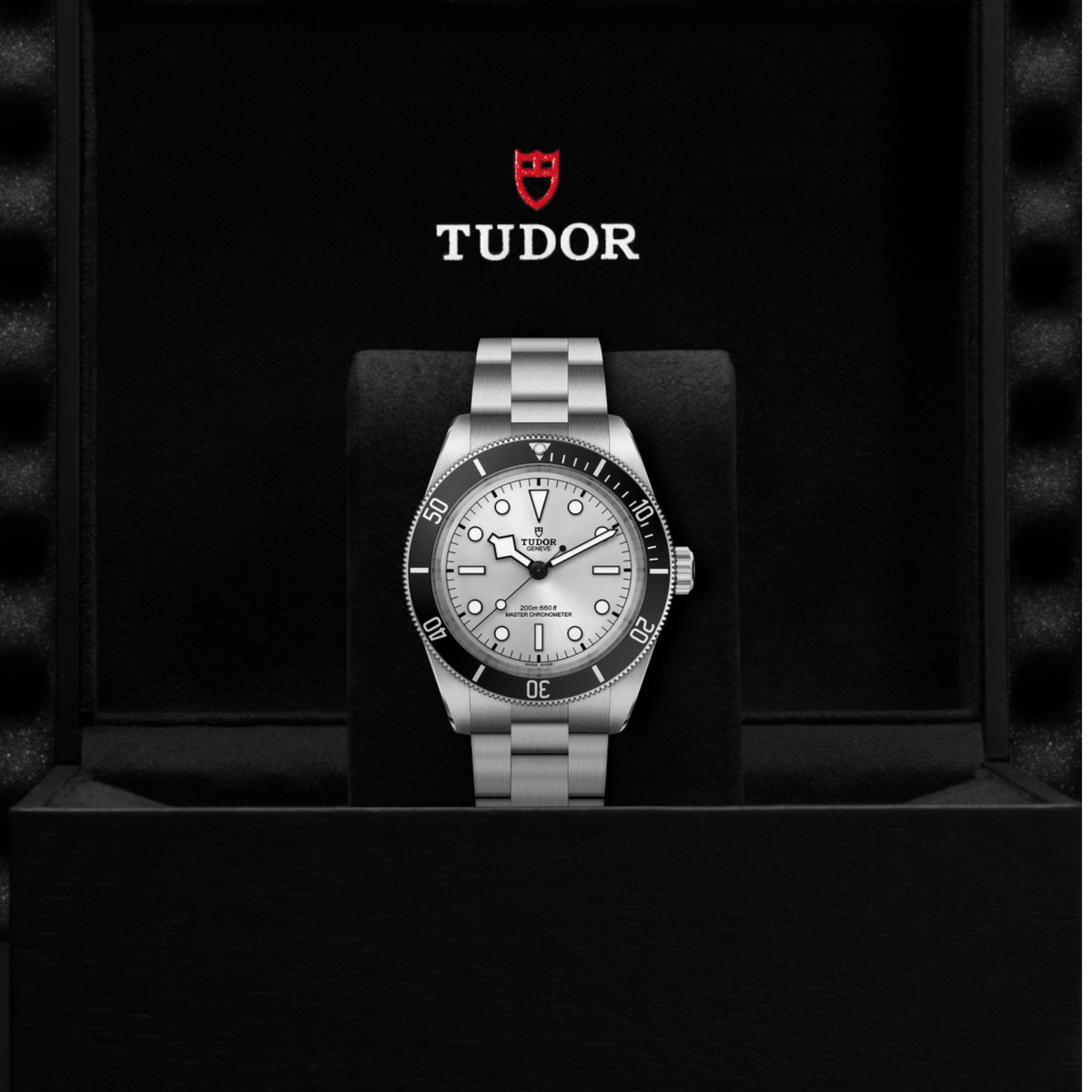 Tudor dive watch displayed in its presentation box showcasing the premium packaging and interior finish