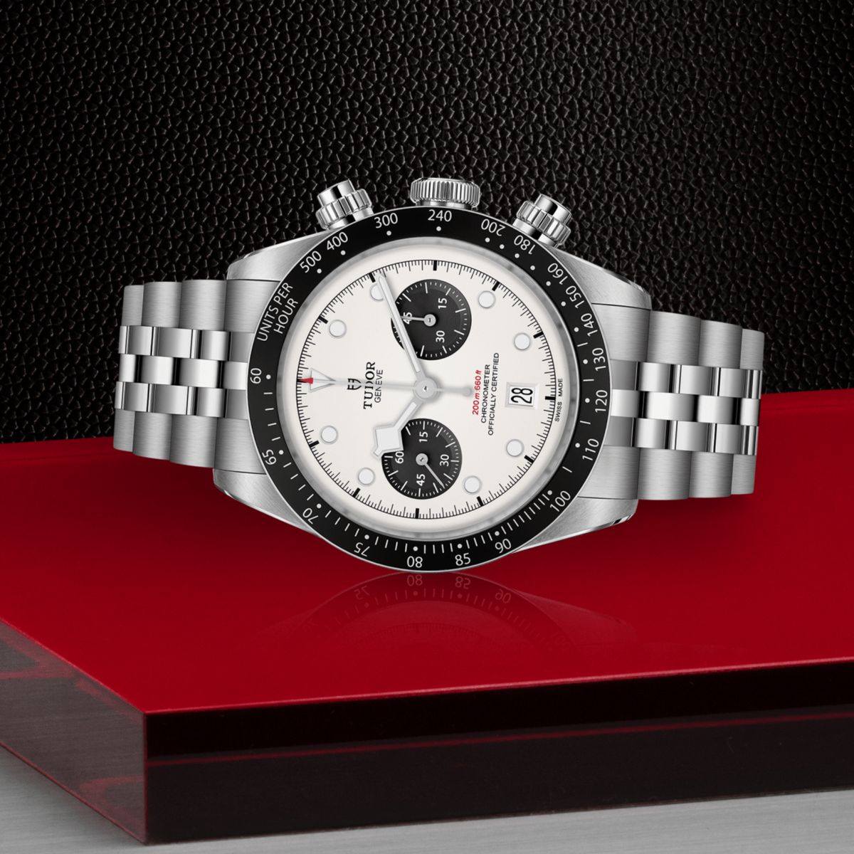 Tudor chronograph positioned on its side highlighting the case thickness, tachymeter bezel edge, crown and pushers