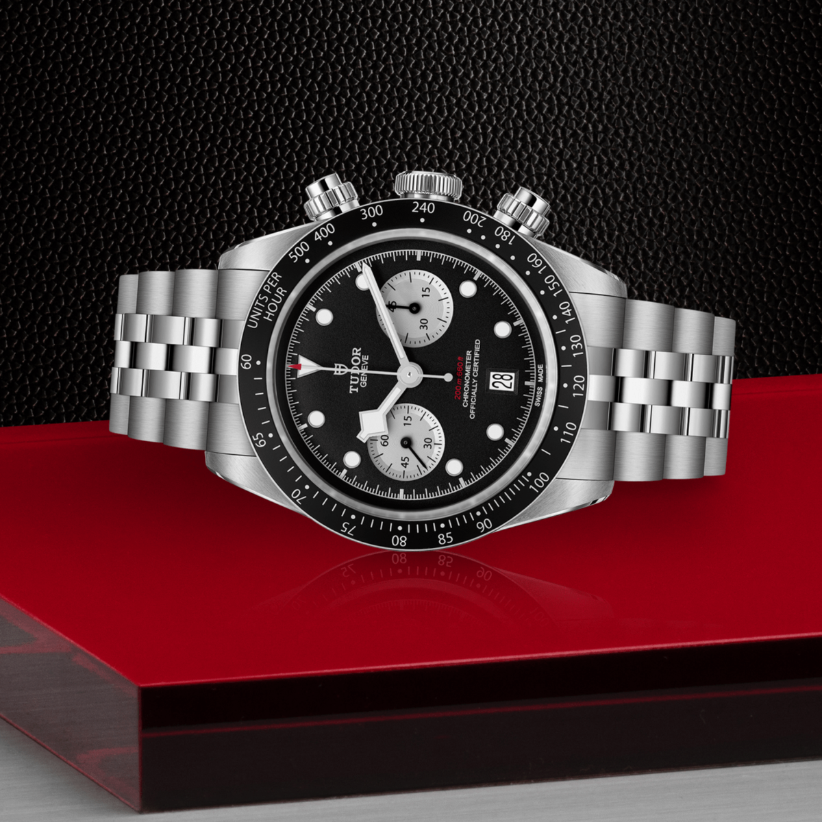 Tudor chronograph positioned on its side highlighting the case thickness, tachymeter bezel edge, crown and pushers