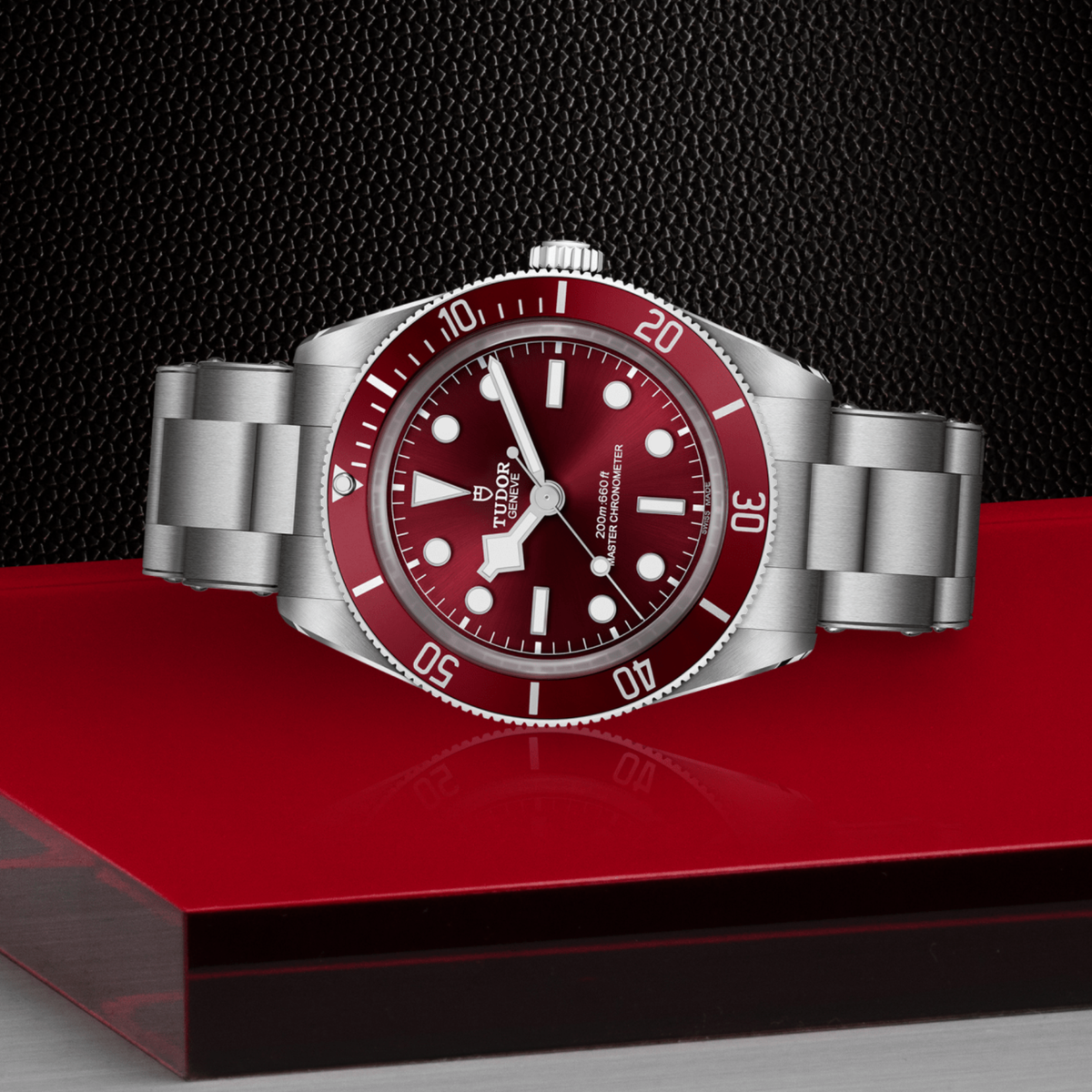 Tudor dive watch positioned on its side highlighting the case thickness, rotating bezel edge and screw-down crown