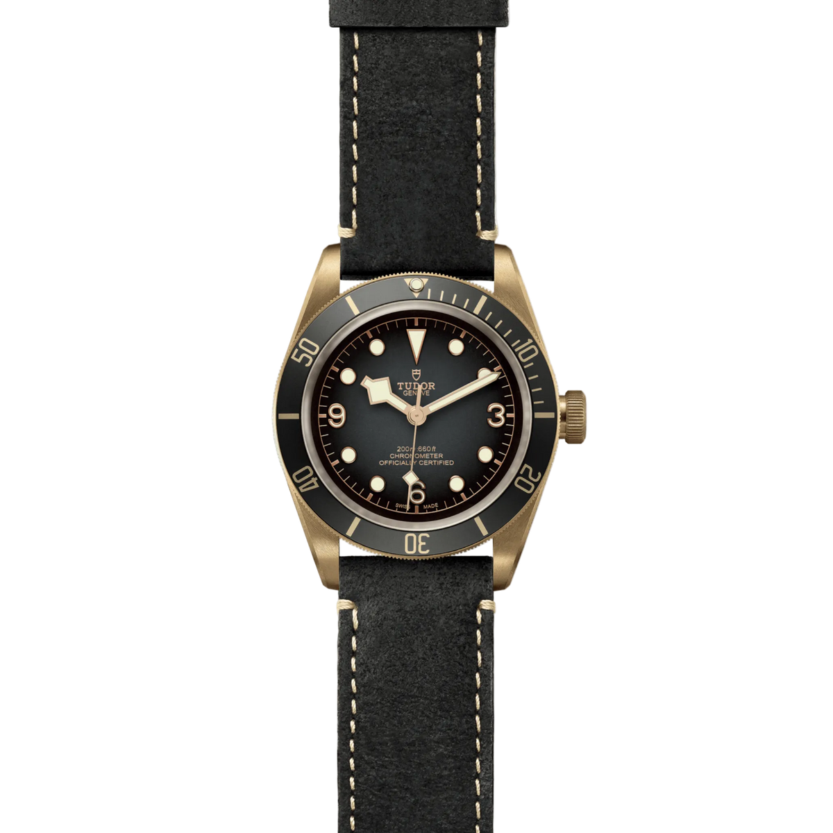 full view of Tudor watch showing the complete aged leather strap and warm bronze case profile