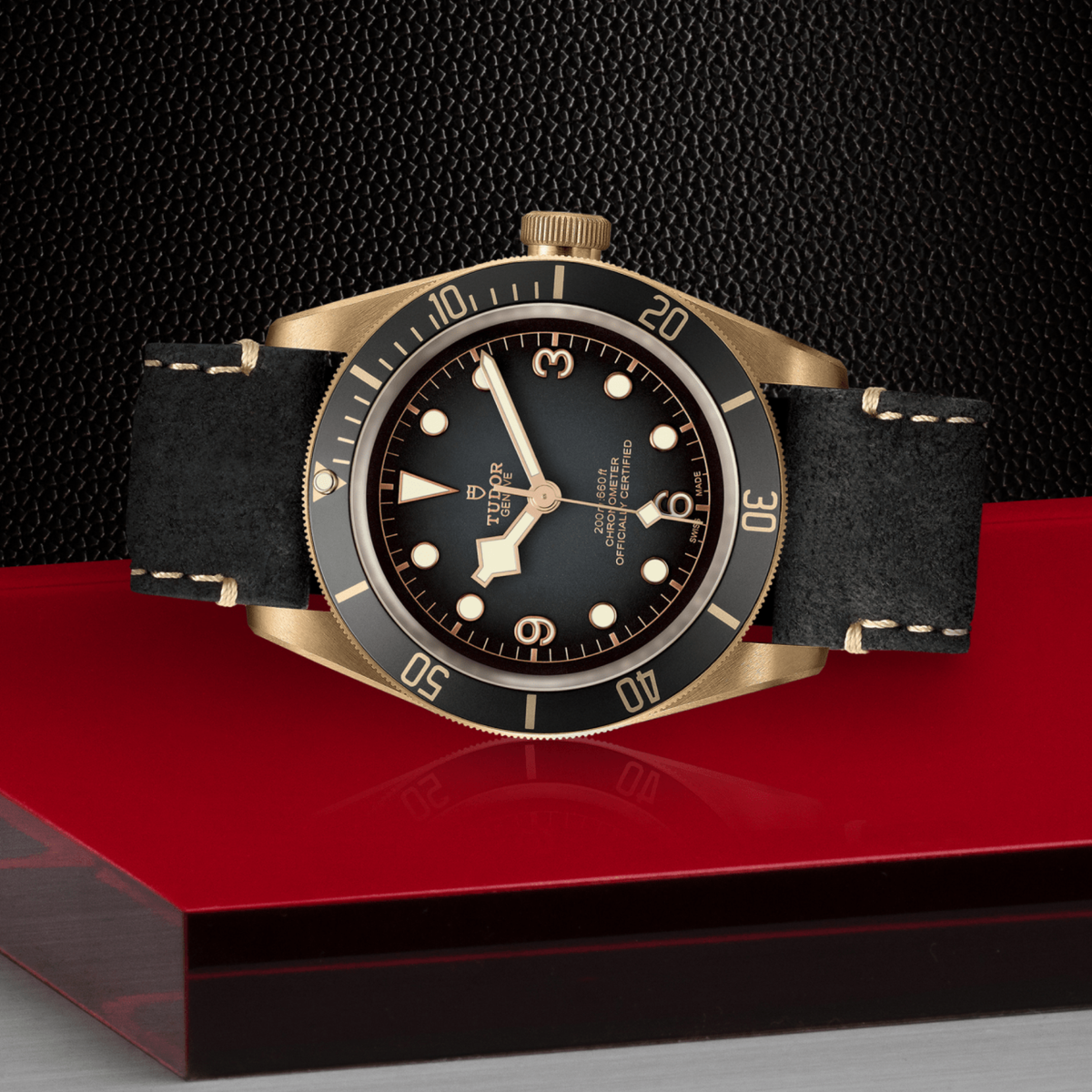 Tudor watch positioned on its side highlighting the bronze case thickness, bezel edge and crown detail