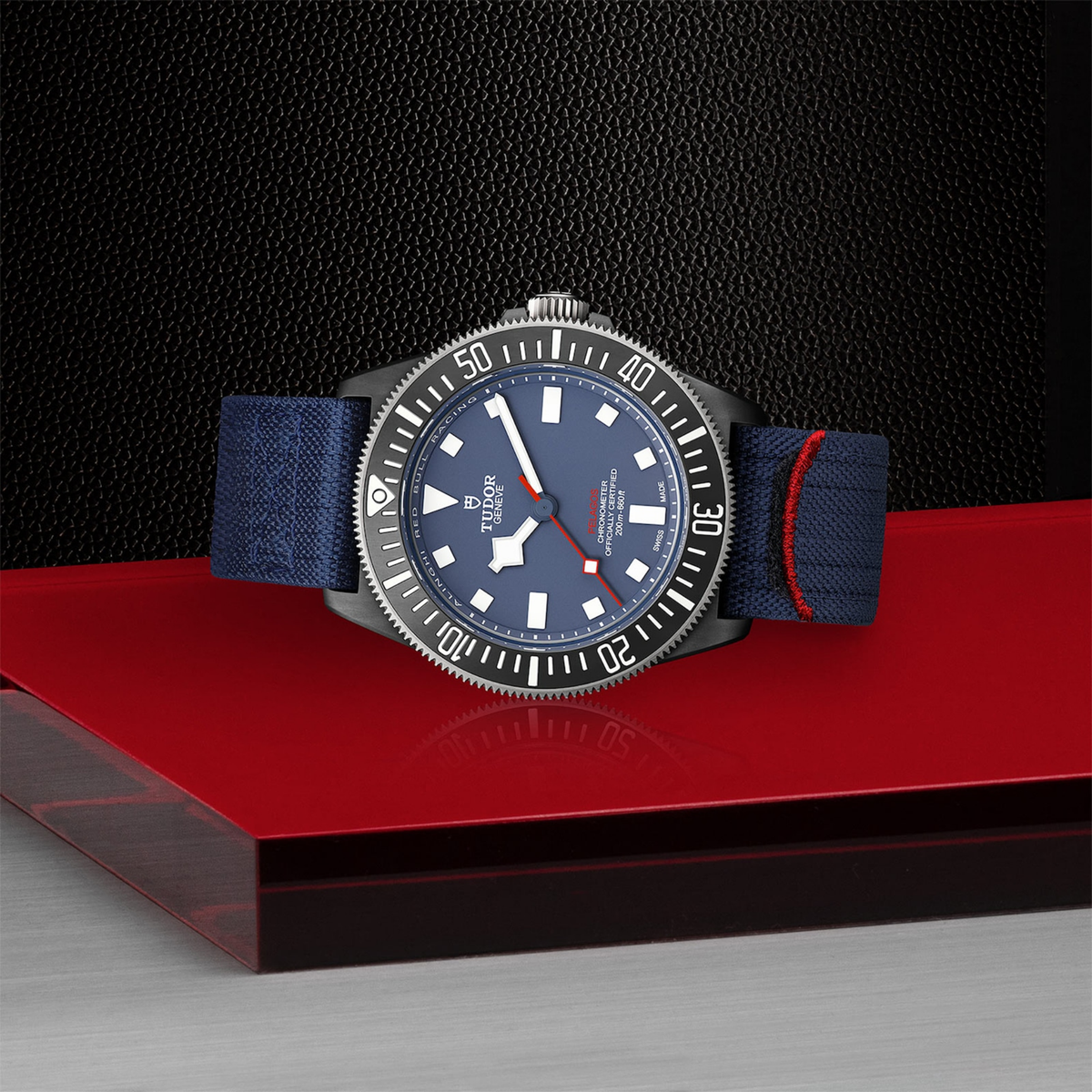 TUDOR Pelagos FXD luxury sports watch with matte blue dial, black carbon composite case, blue fabric strap and 200m water resistance