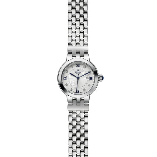 full view of Tudor watch showing the complete stainless steel bracelet and elegant compact case profile
