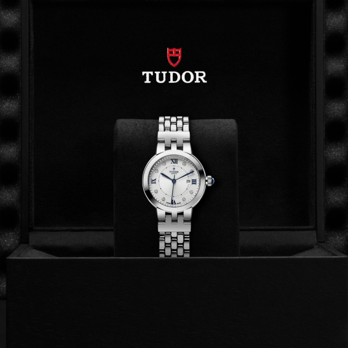 Tudor watch displayed in its presentation box showcasing the premium packaging and interior finish
