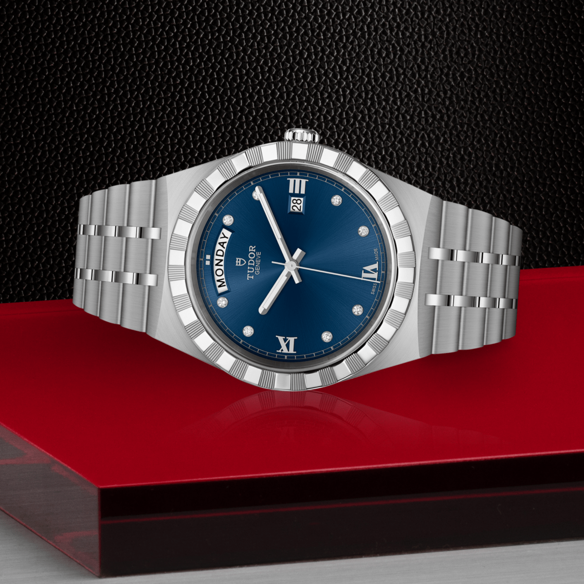 Tudor watch positioned on its side highlighting the case thickness, notched bezel edge and screw-down crown detail