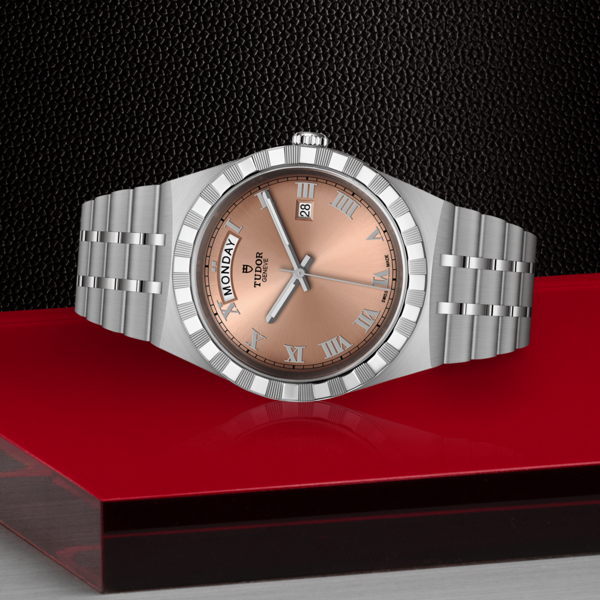 Tudor watch positioned on its side highlighting the case thickness, notched bezel edge and screw-down crown detail