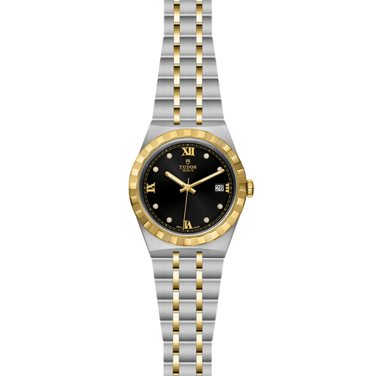Two-tone watch with black dial and gold accents on a white background