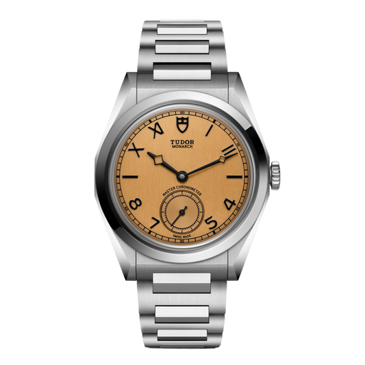 front view of Tudor Monarch salmon dial watch with black Arabic numeral hour markers, small seconds display and stainless steel bracelet.