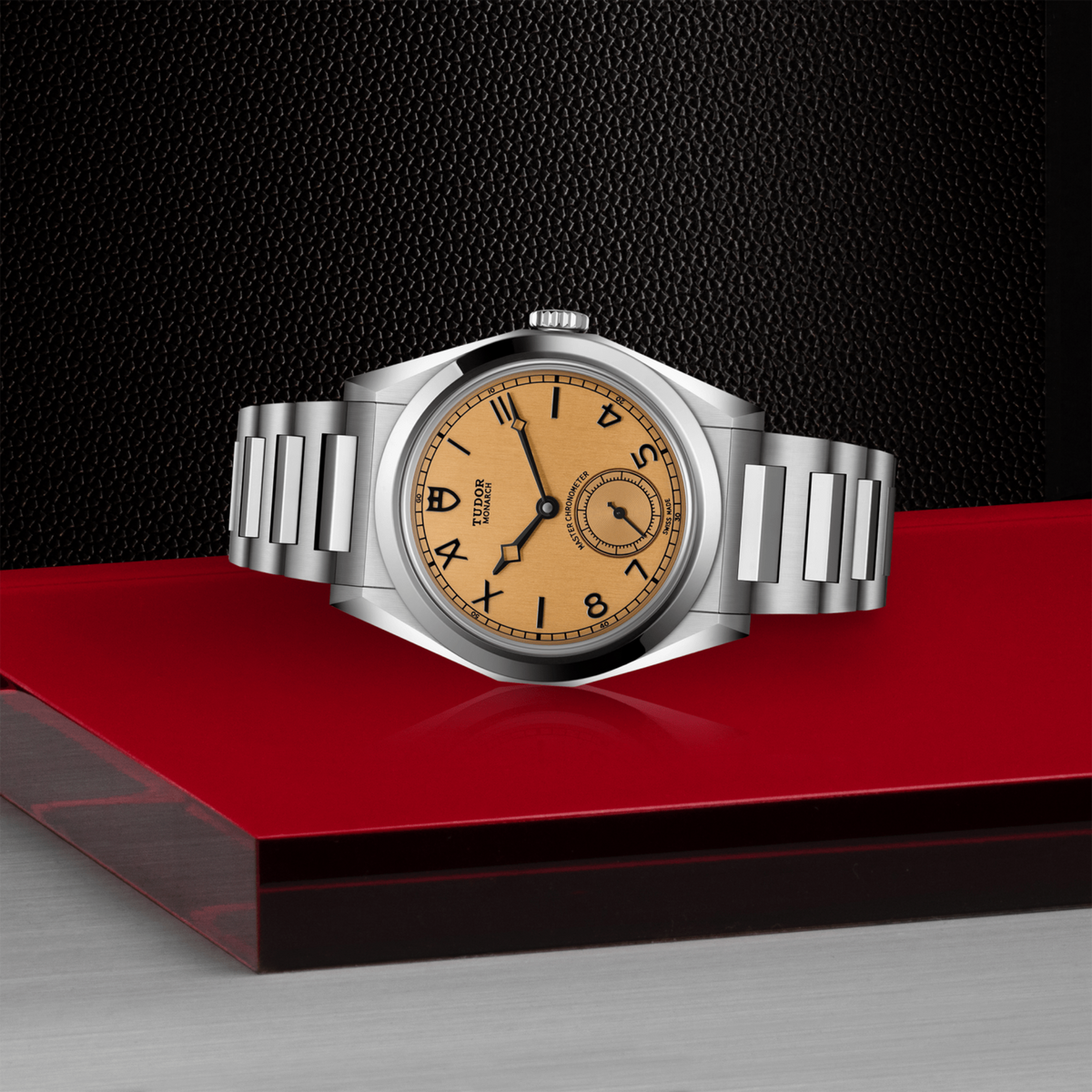 side view of Tudor Monarch watch case, crown and brushed stainless steel profile
