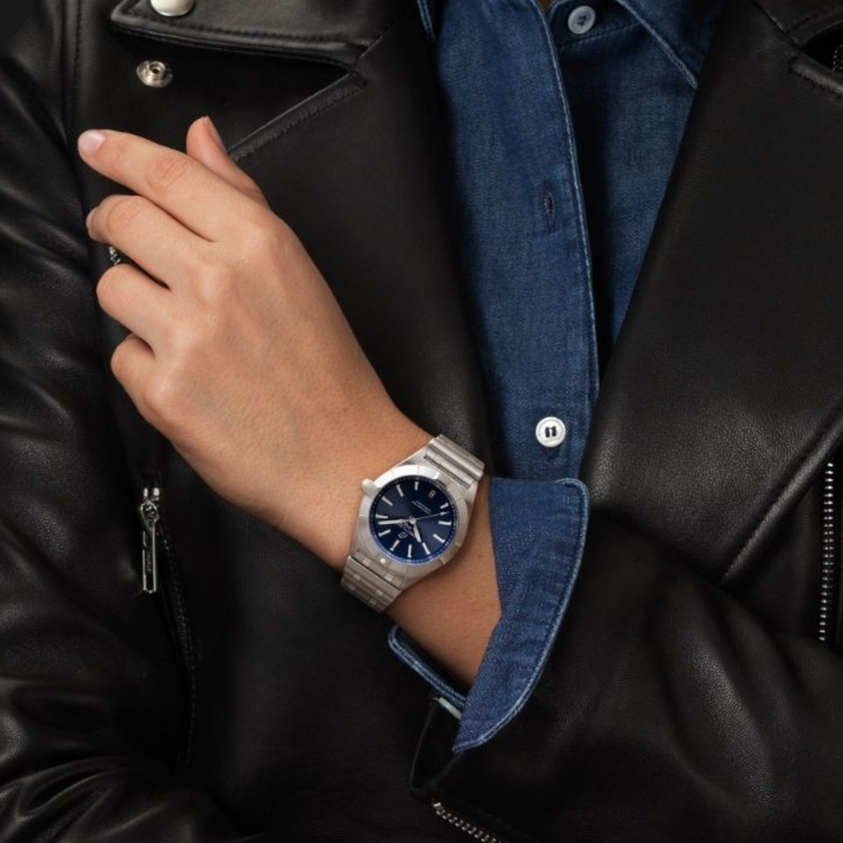 Breitling Chronomat Automatic blue dial watch worn on wrist with stainless steel bracelet