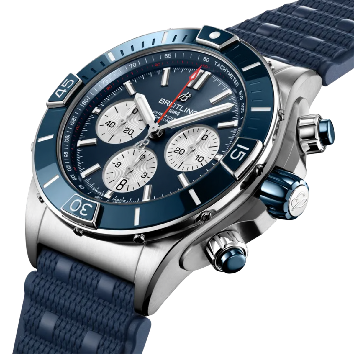 Angled close-up of the Breitling Super Chronomat B01 44 featuring a blue sunray dial, stainless steel chronograph case, blue ceramic bezel, and blue rubber strap.