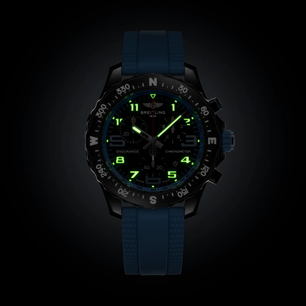 Breitling Endurance Pro chronograph black dial watch worn on wrist with blue rubber strap