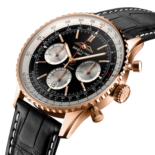 side view of Breitling Navitimer chronograph showing rose gold case pushers crown and slide rule bezel