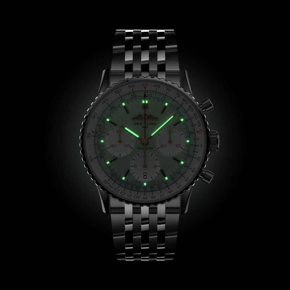 Breitling Navitimer chronograph green dial watch worn on wrist with stainless steel bracelet