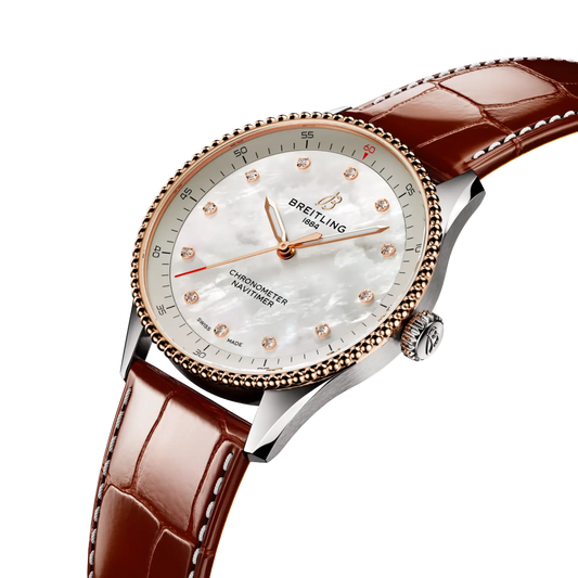 side view of Breitling Navitimer Automatic showing steel and rose gold case crown and beaded bezel detail