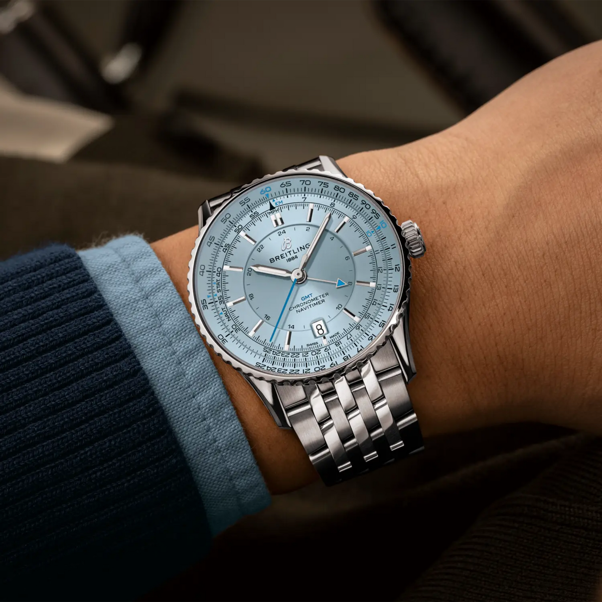 Breitling Navitimer GMT ice blue dial watch worn on wrist with stainless steel bracelet