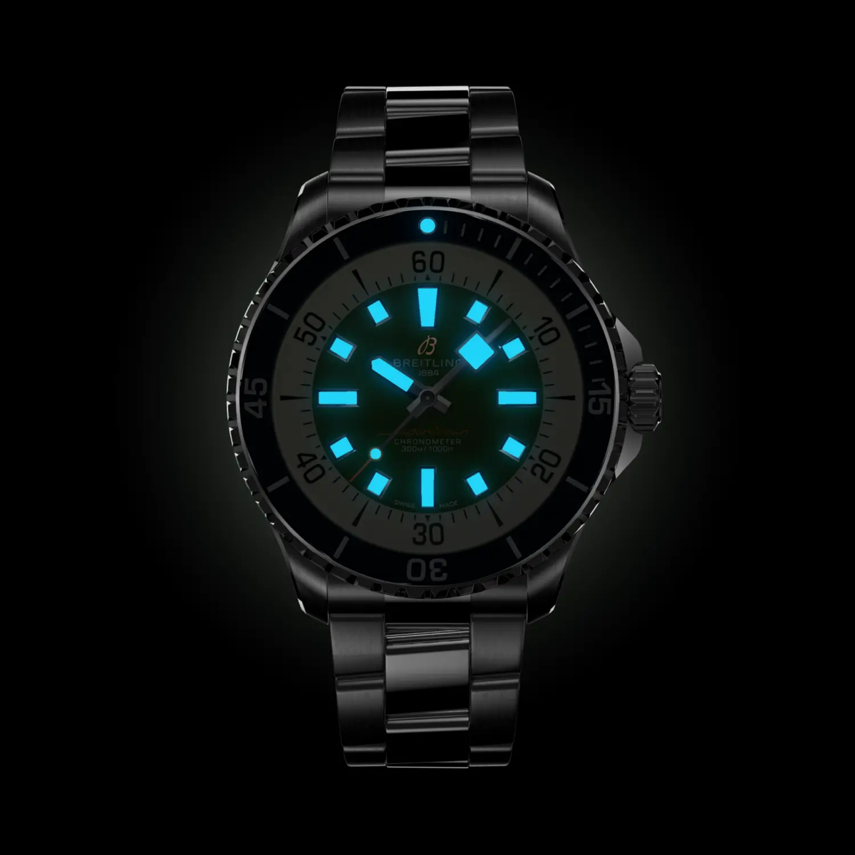 Breitling Superocean green dial diver watch shown glowing in the dark for great visibility 