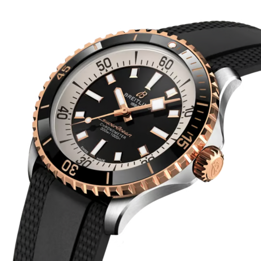 side view of Breitling Superocean two-tone case rose gold crown and black ceramic bezel detail