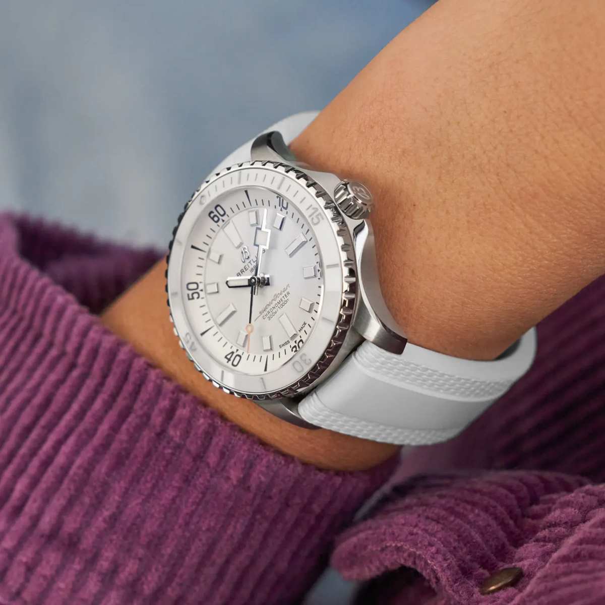 Breitling Superocean white dial rubber strap watch styled on wrist with a fresh, sporty look