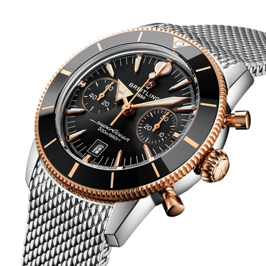 side view of Breitling Superocean Chronograph case highlighting the pushers, crown and refined two-tone detailing
