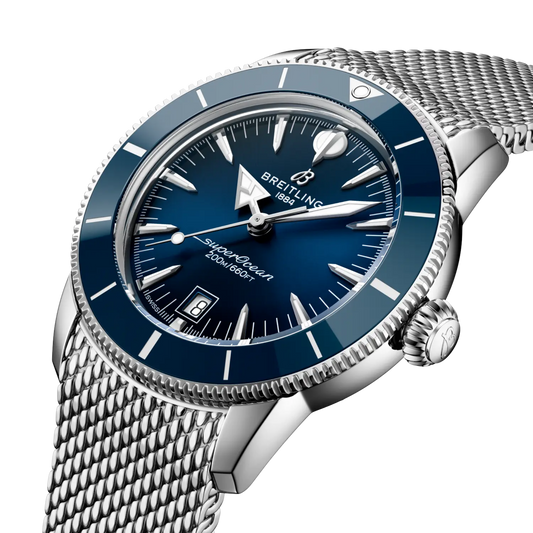 side view of Breitling Superocean Heritage stainless steel case blue bezel mesh bracelet detail